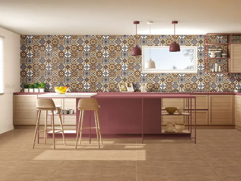 Elegant beige kitchen featuring an island design and Moroccan-inspired decorative wall tiles.